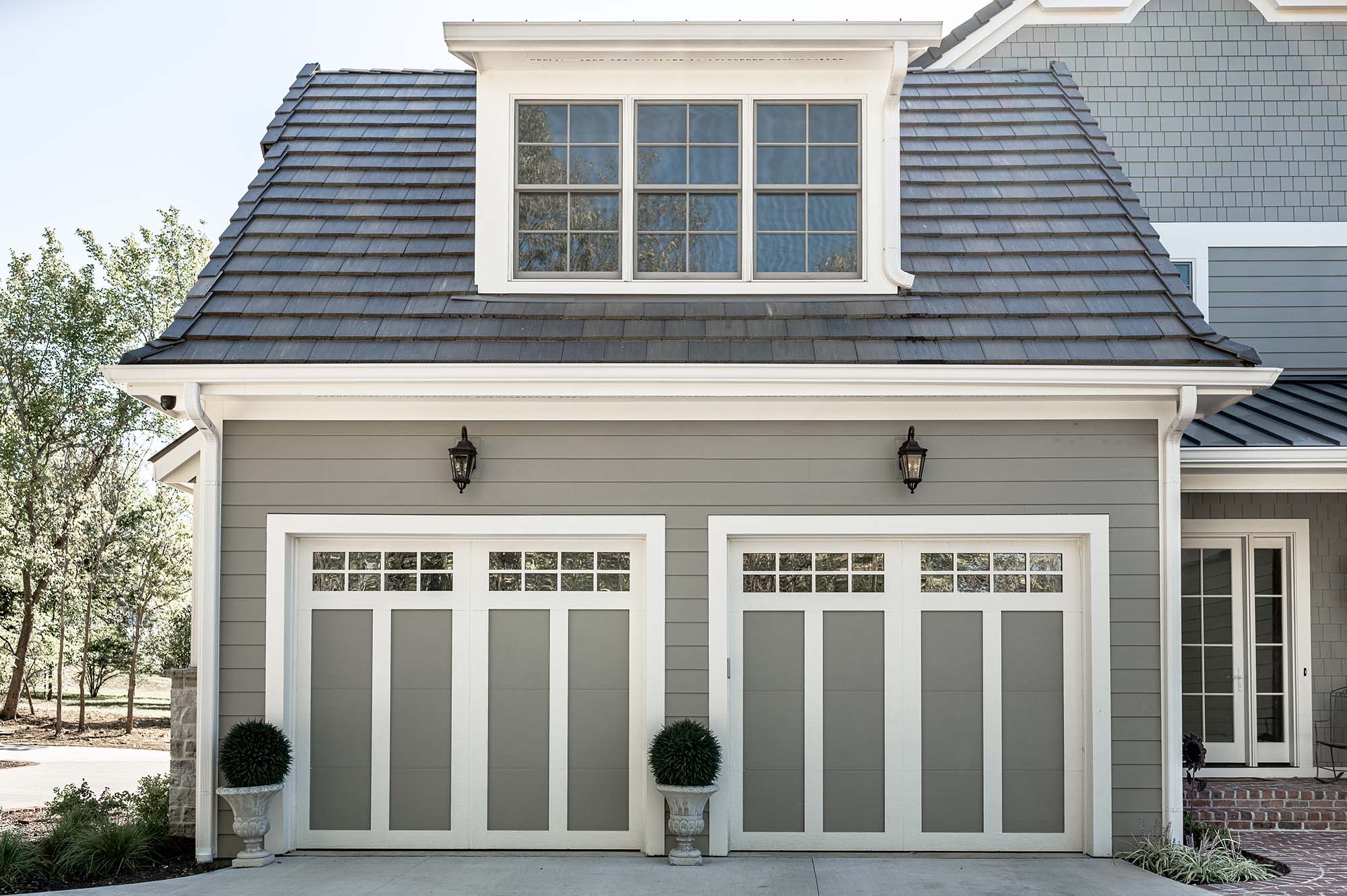 Stylish gray and white garage door with windows