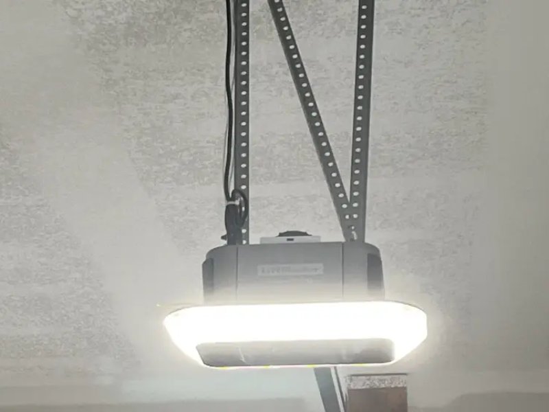 LED garage light mounted on the ceiling, providing bright illumination for workspaces and garages.